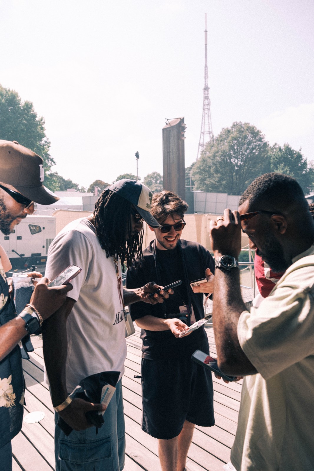 A group gathering backstage during the daytime at Big Smoke.