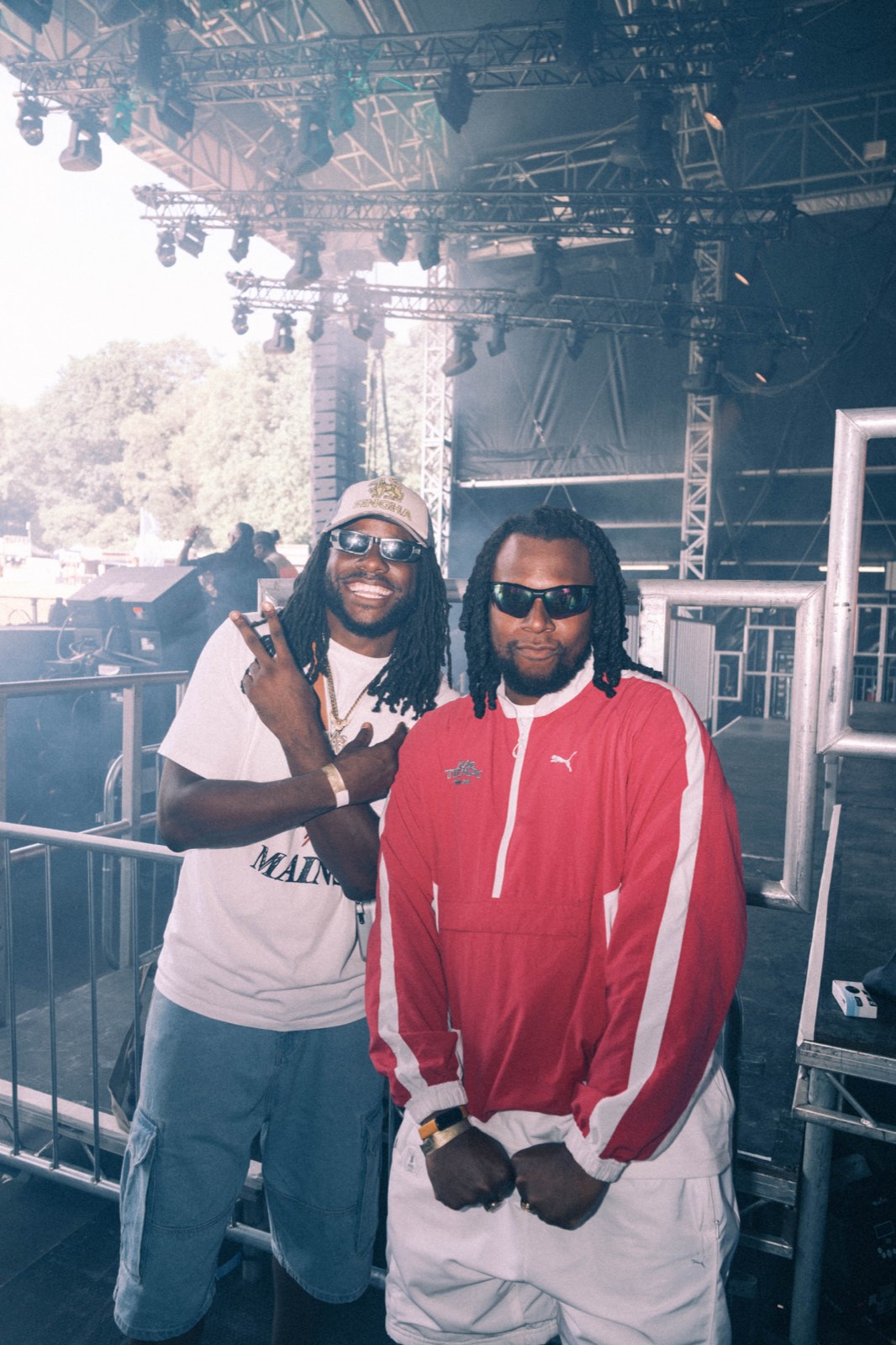 Two guests posing beside the Big Smoke stage.