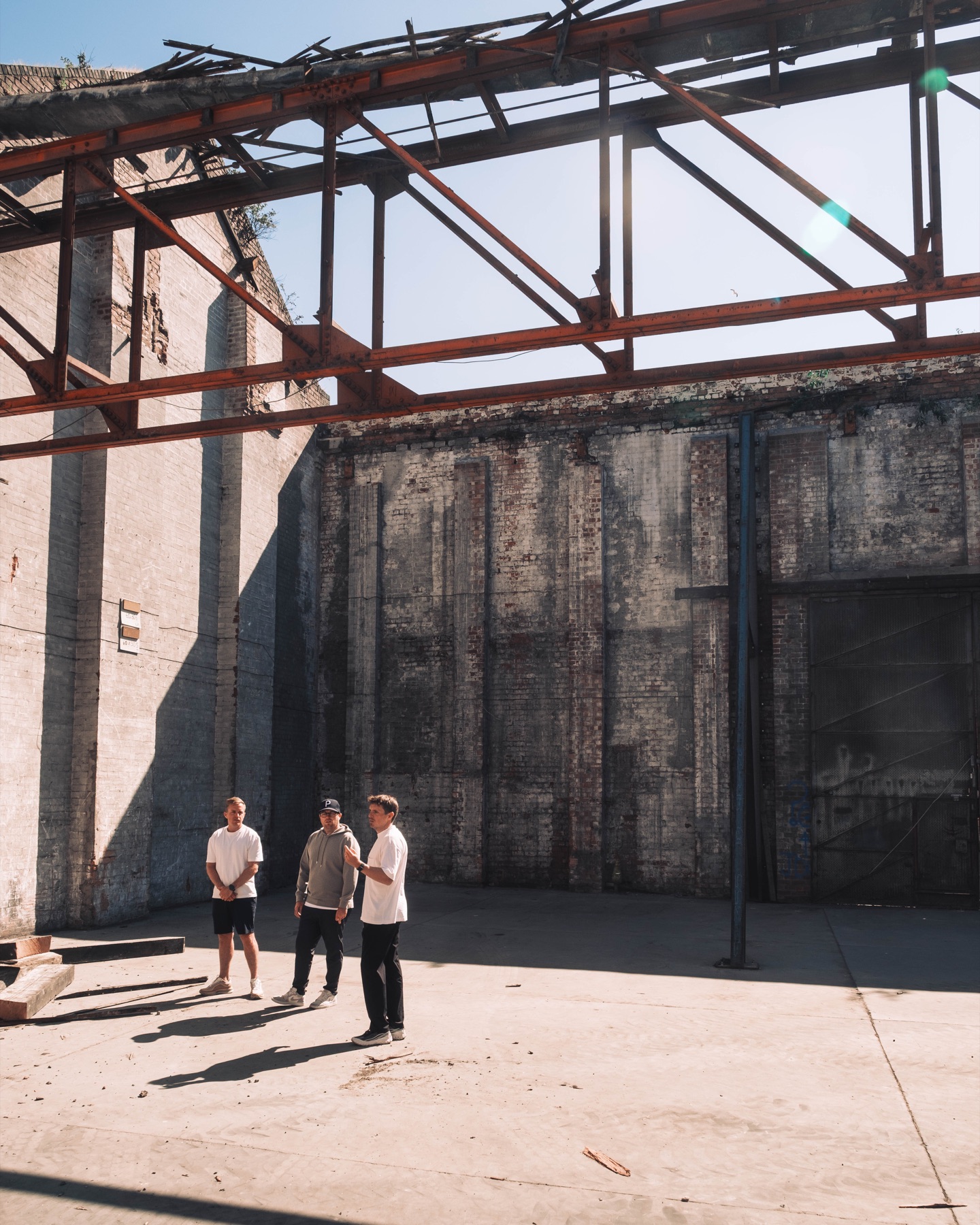 Club Mona founders framed by the scale of the unfinished venue
