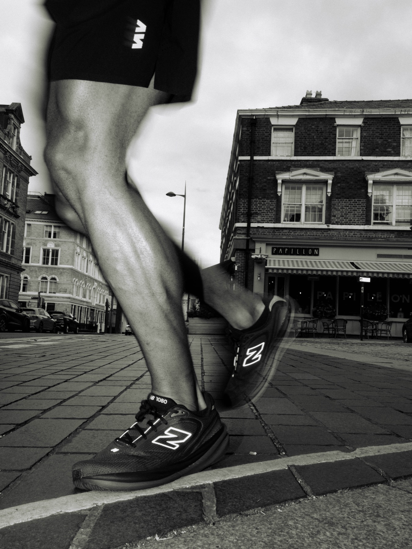 Close crop of a runner in motion in black and white