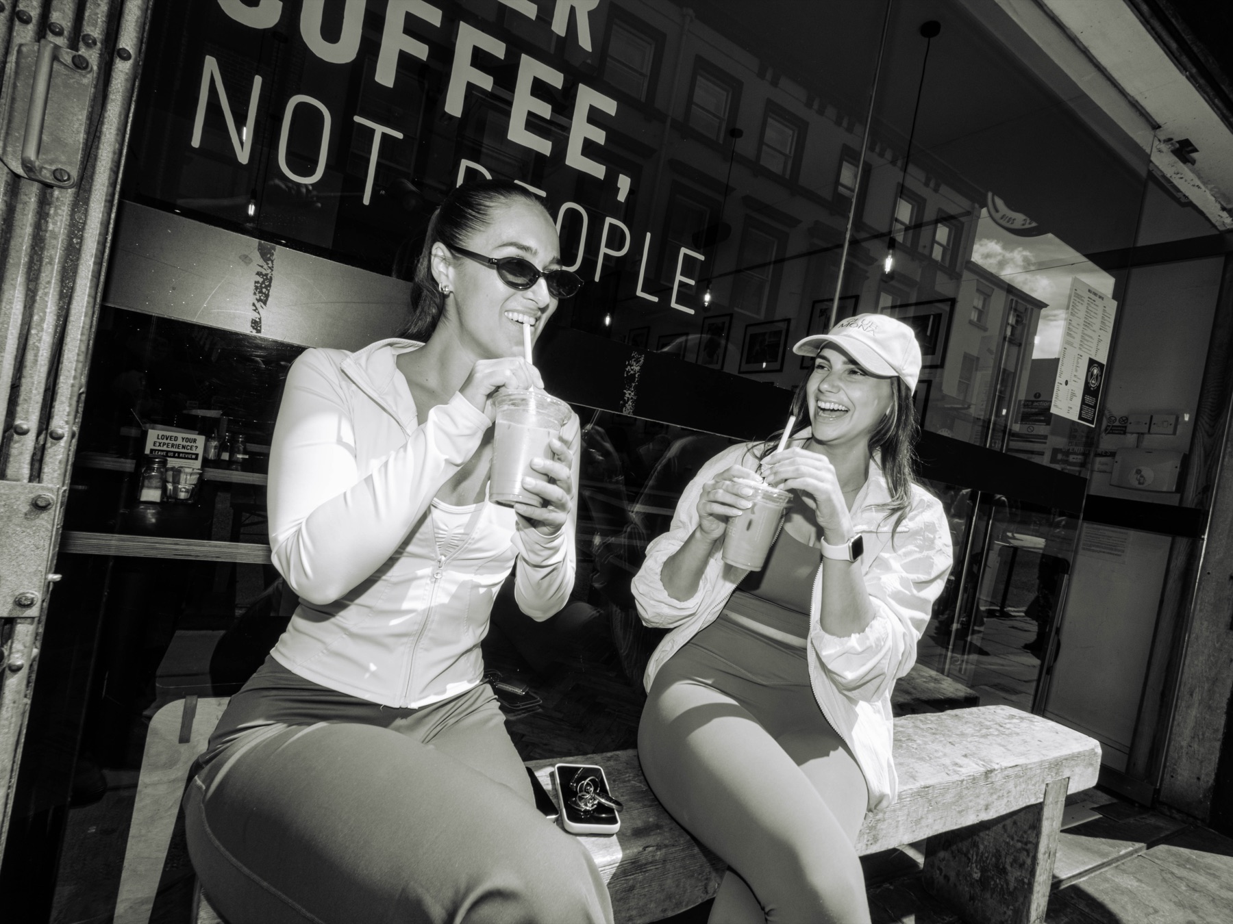 Friends sharing drinks during the Club Mona campaign shoot