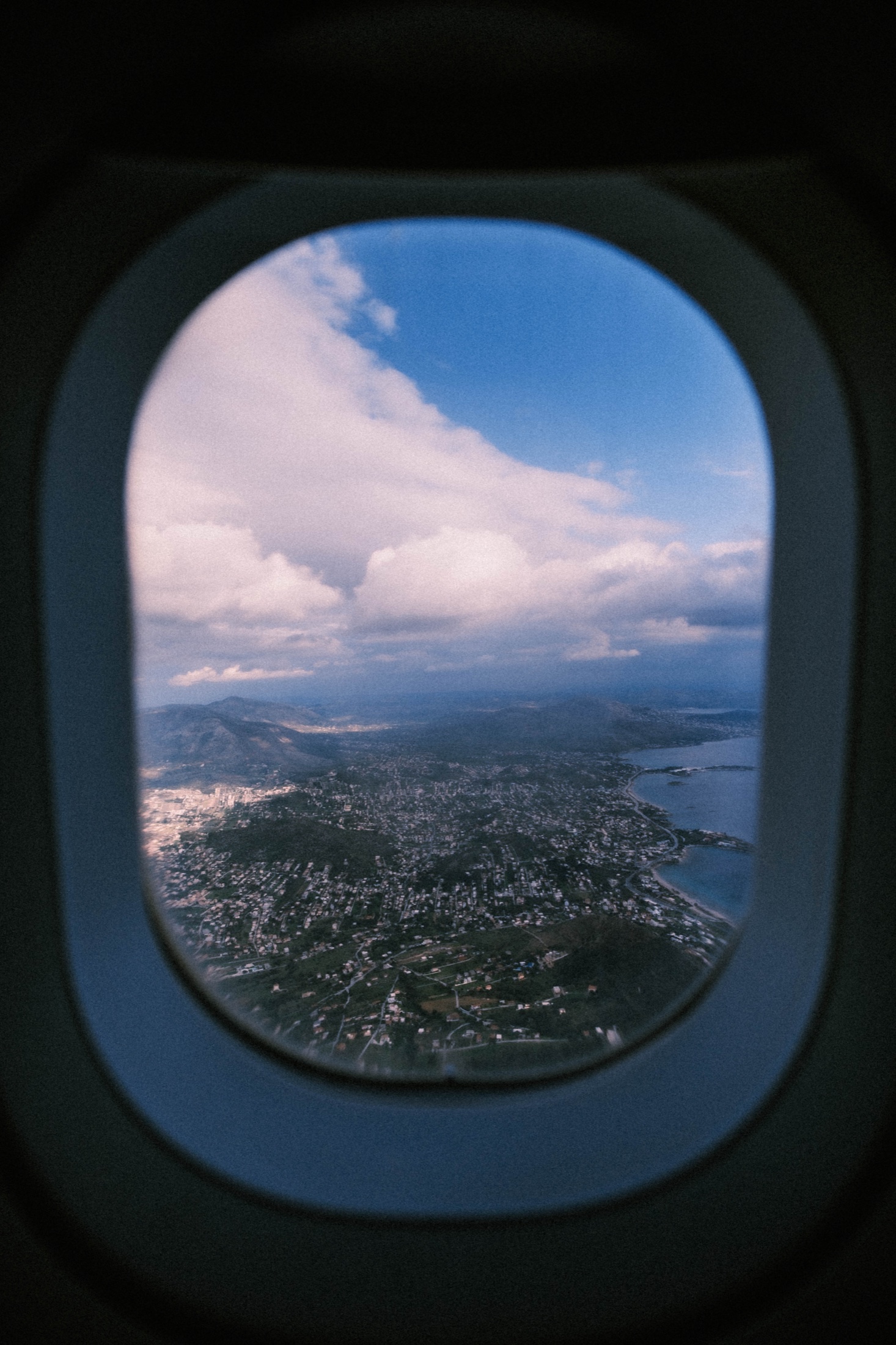 A coastline seen through the window during a flight.