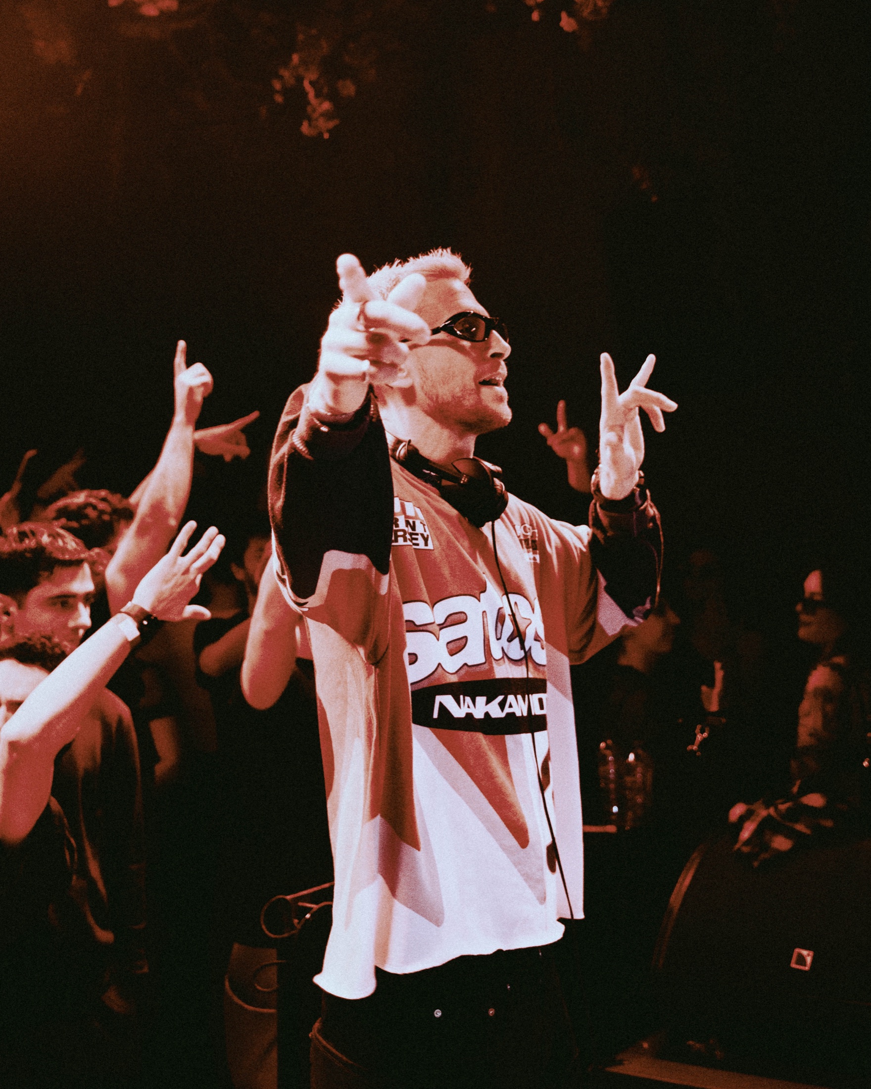 Eli Brown gesturing towards the crowd during a live set.