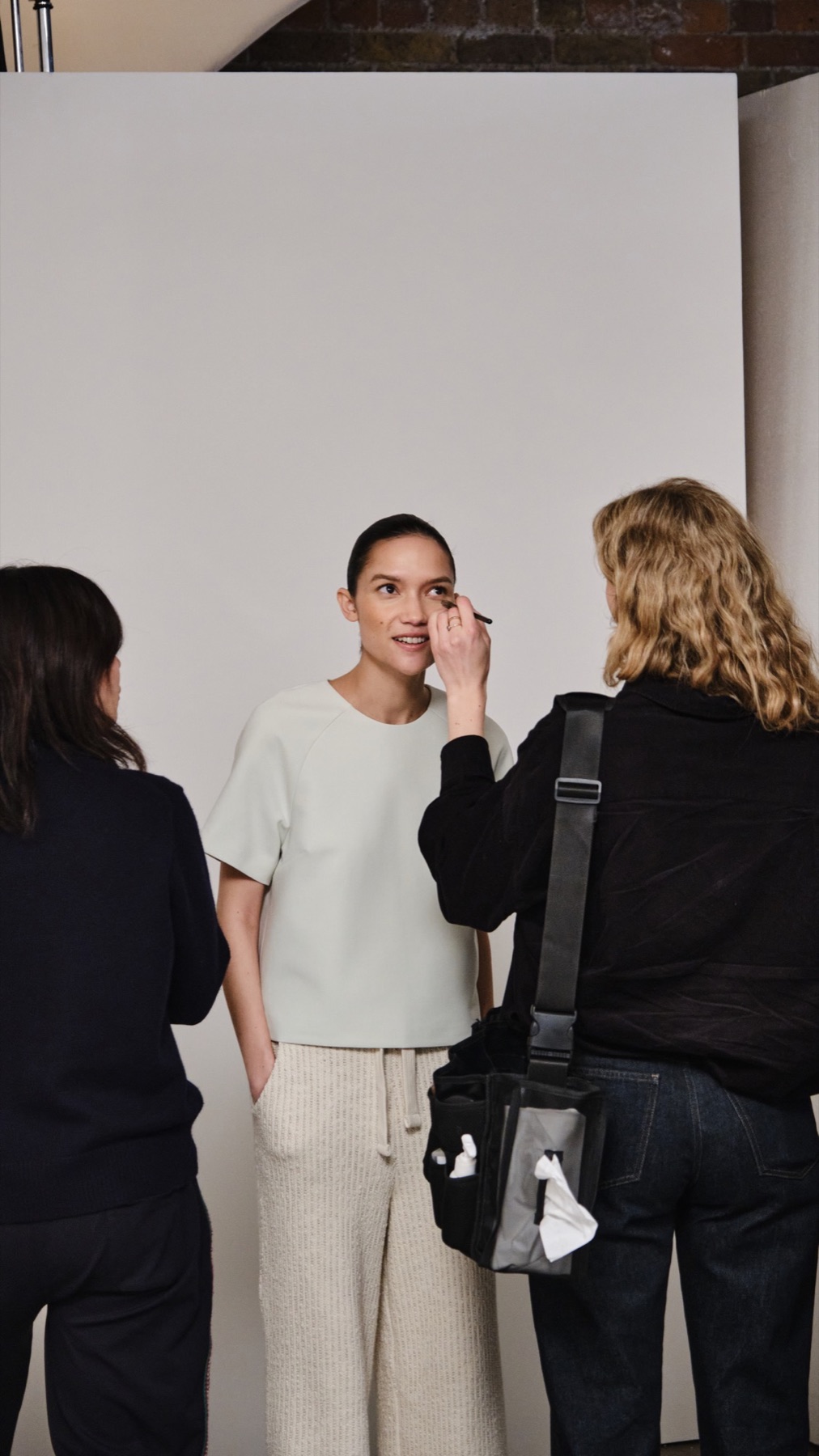 Emello SS26 campaign model photographed on set