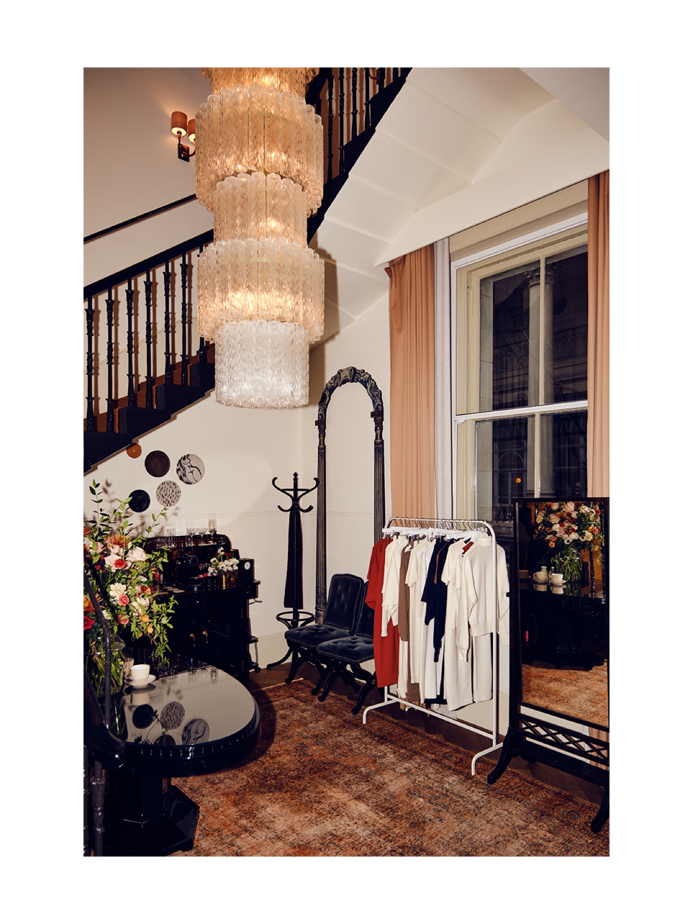 Emello garments beneath a chandelier at a private press day