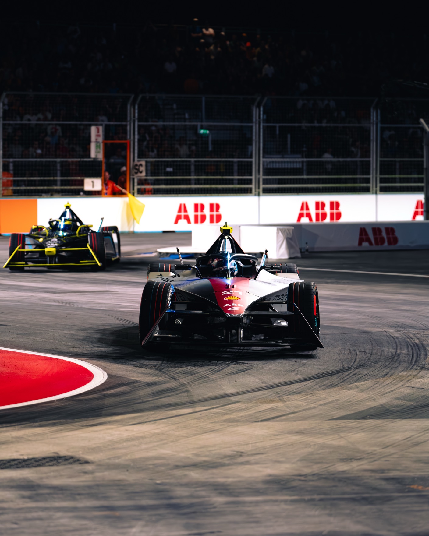 Formula E cars taking a corner at the 2024 London E-Prix