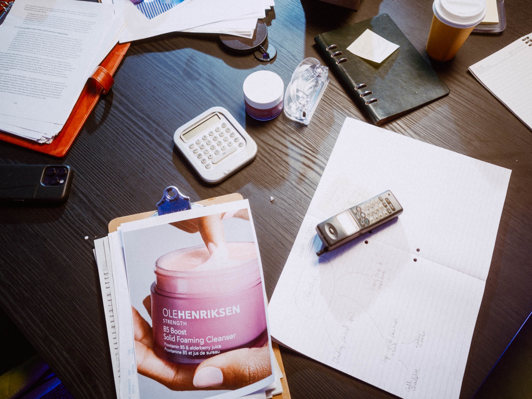OLEHENRIKSEN cleanser reference and stationery on the boardroom table