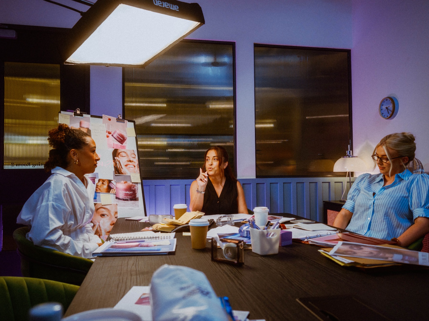 Space NK’s PR team together on the boardroom set