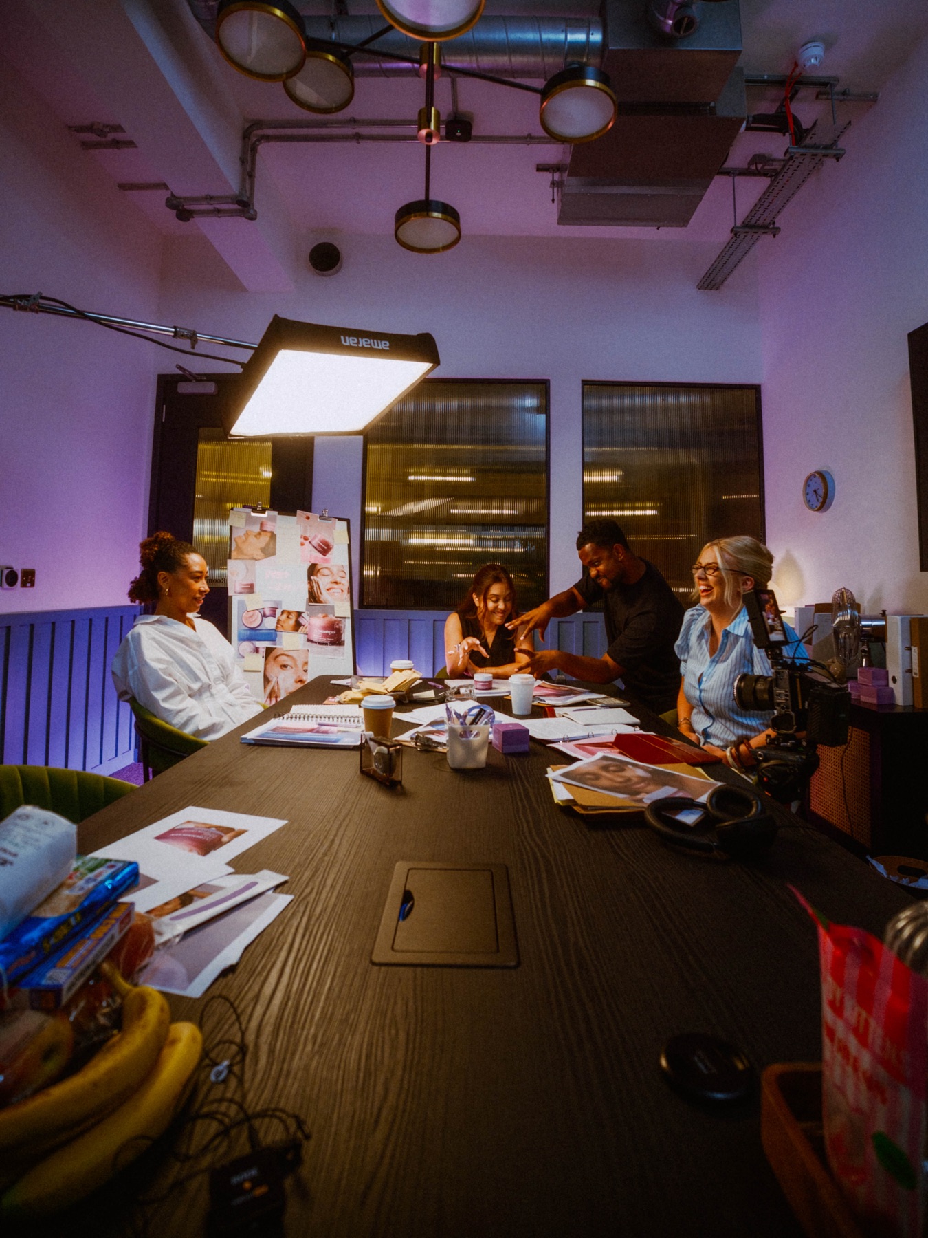A moment between takes with the team, camera and lighting in view