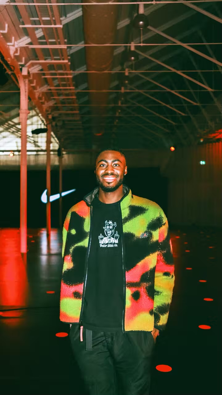 Demonét Stapleton-Rawlins smiling in a colourful jacket
