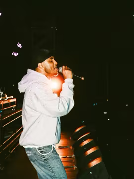 Singer performing live in Demonét's selected work