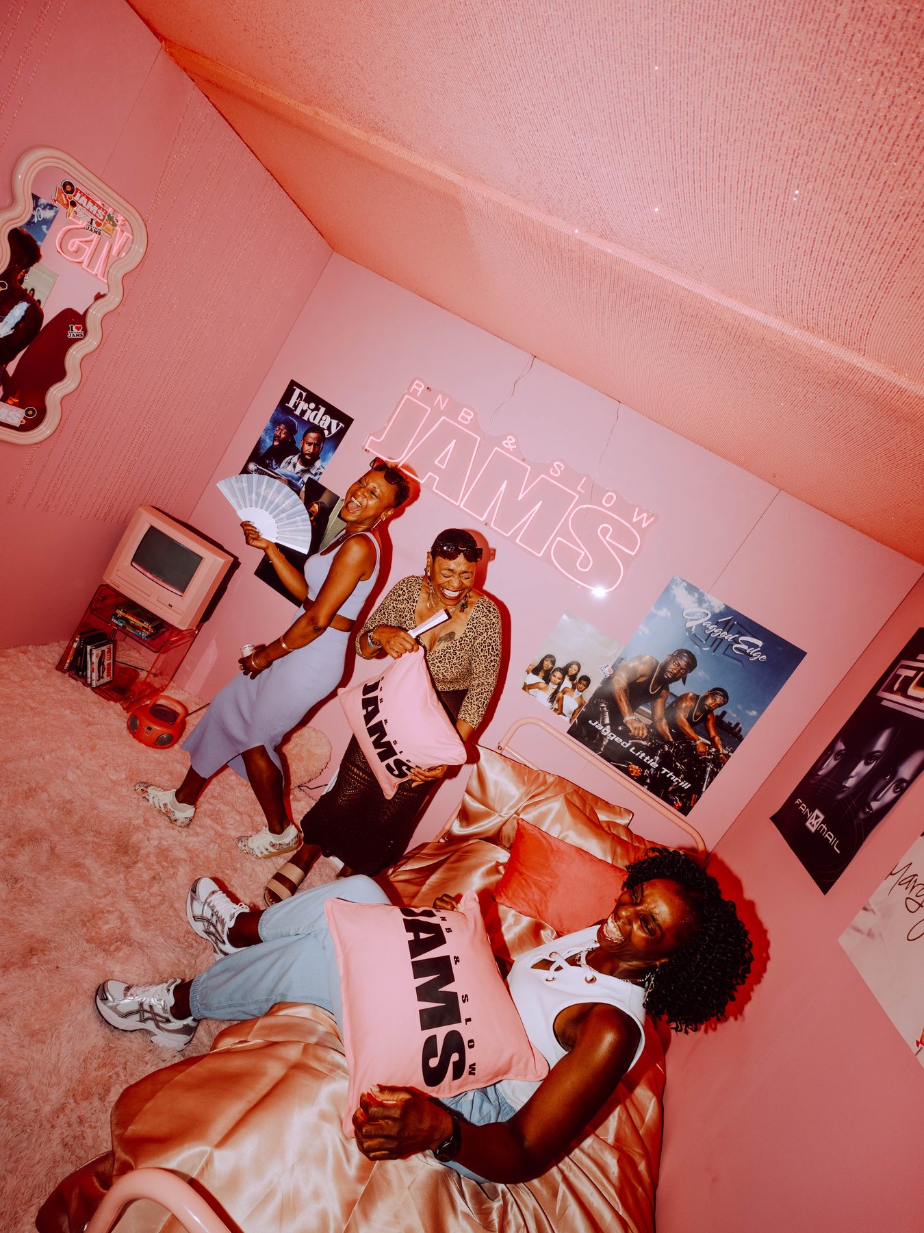 Guests inside a pink R&B Slow Jams branded activation space at Magazine London.