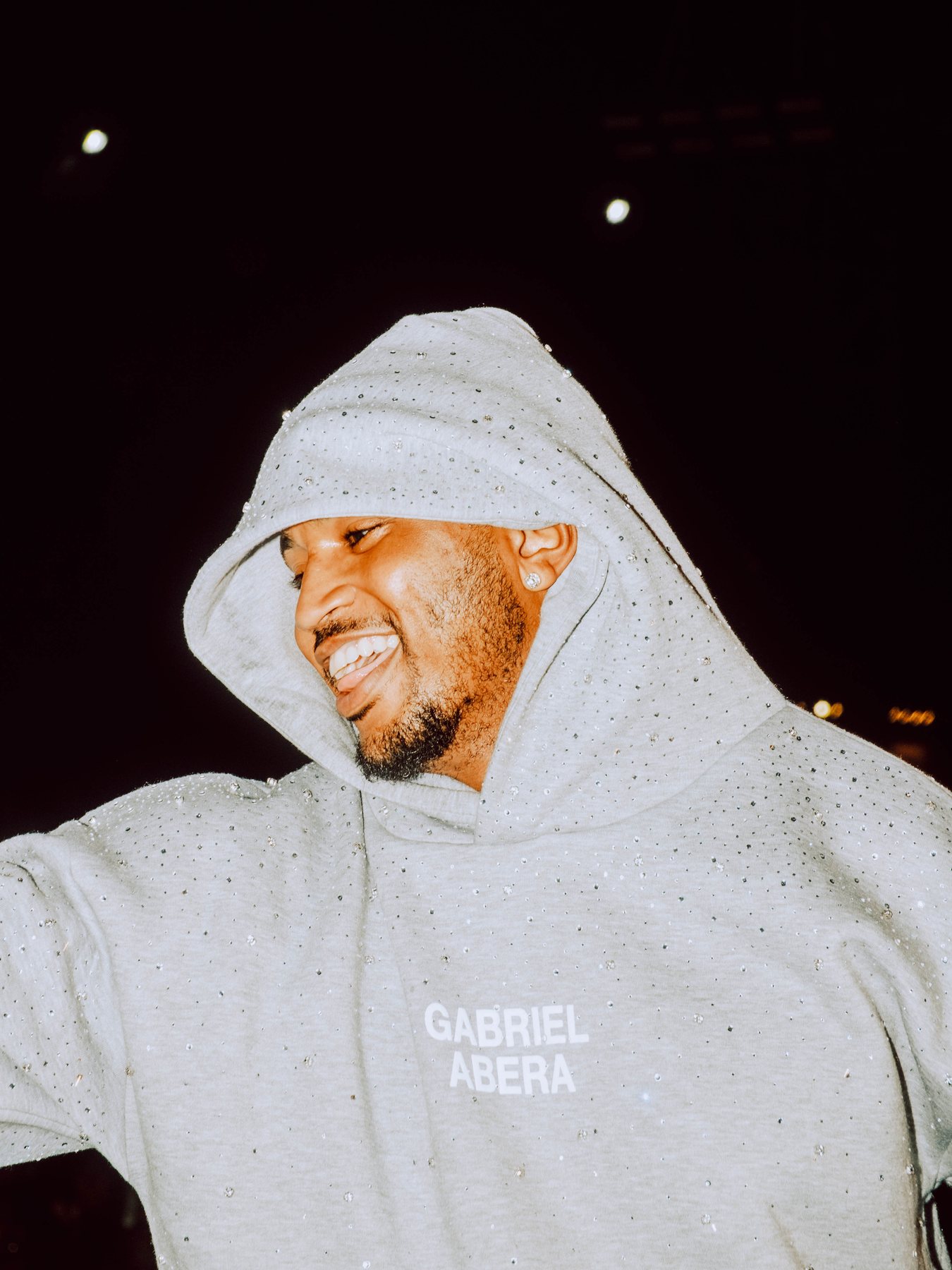Smiling guest photographed backstage at R&B Slow Jams.