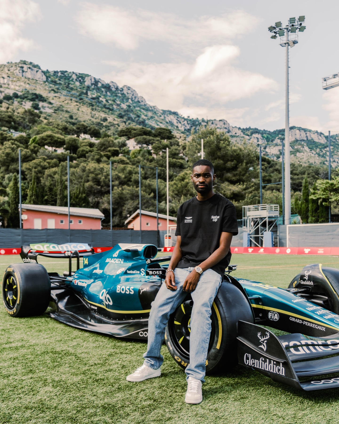 Player photographed beside the Santan Cup racing car.