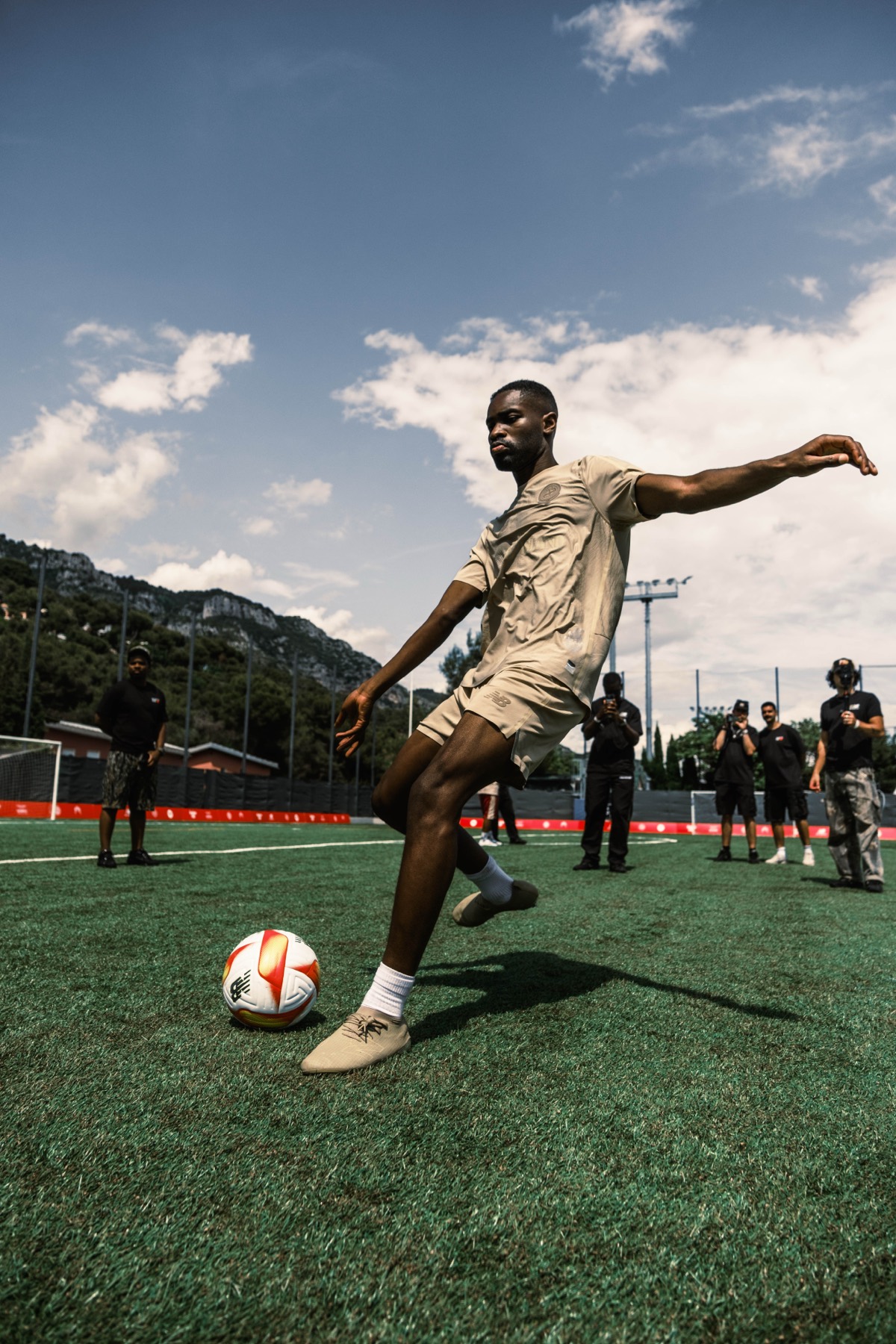 Player striking a football during Santan Cup.