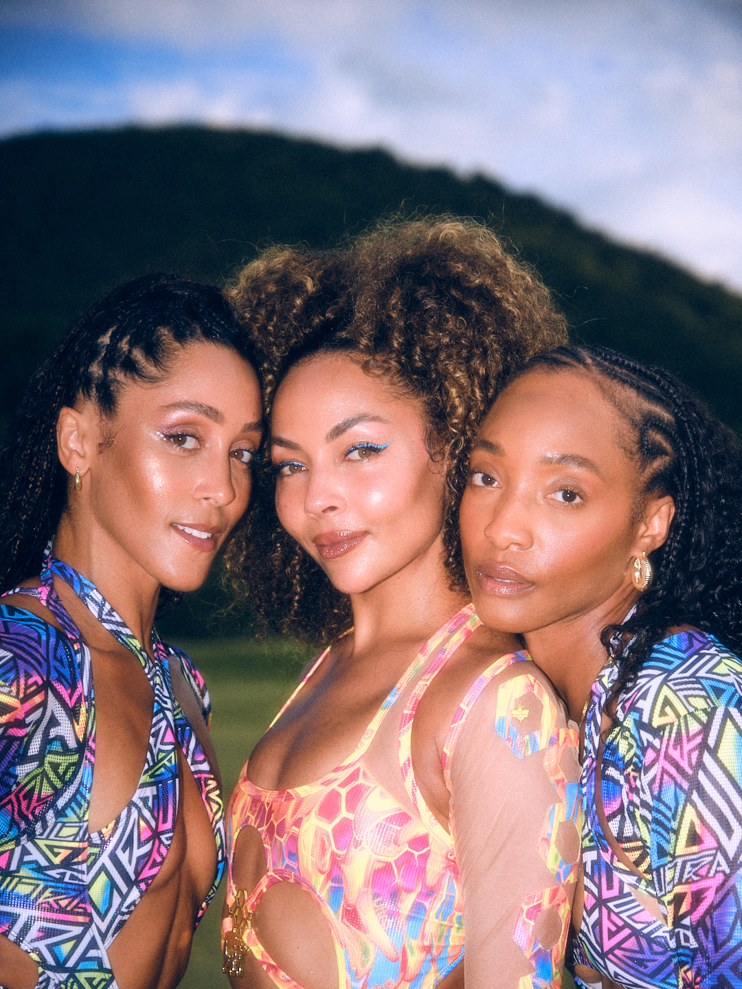 Ashley Everett, Nikeva Marie and Iantha Richardson with their faces together before Carnival in Saint Kitts