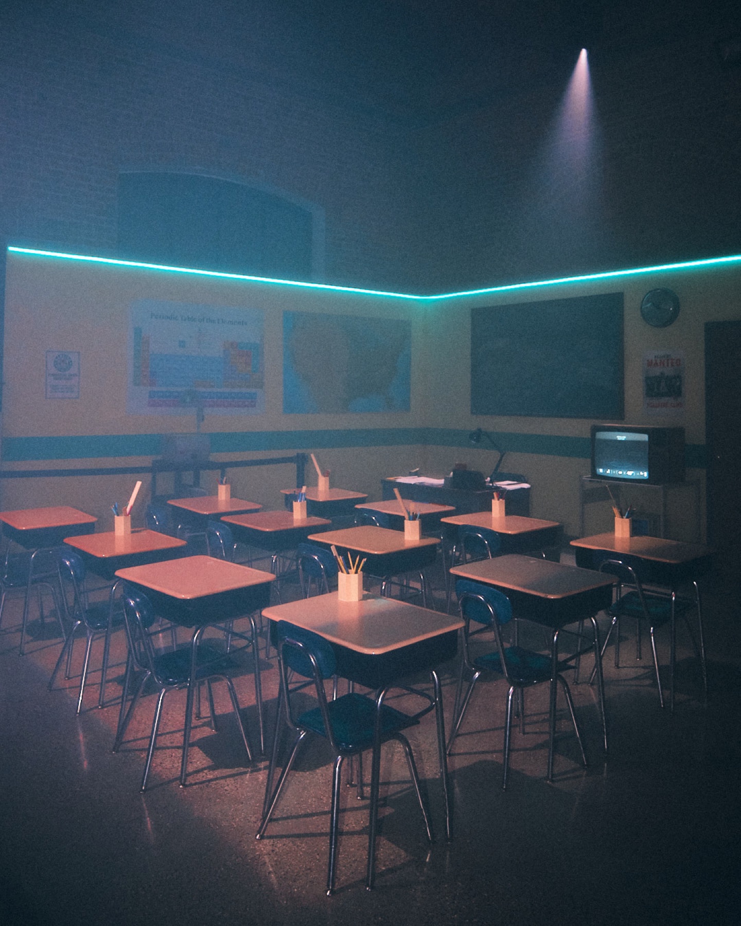 Classroom installation illuminated by a teal light