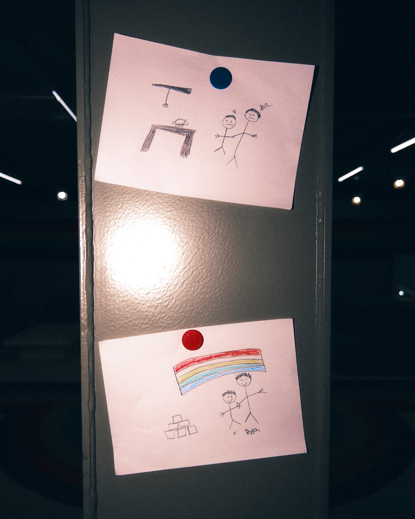 Notes drawn by hand and pinned to a classroom board